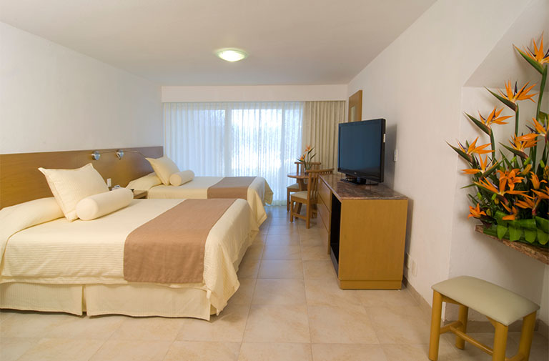 Sunset World Resorts & Vacations Experiences – Resorts -Ocean Spa Hotel | Standard Room – Two full size beds